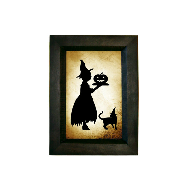 Girl Witch Serving Pumpkin Printed Paper Silhouette Behind Glass in Black Wood frame. 5-1/2