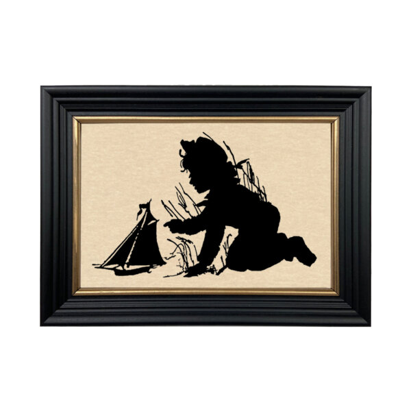 Framed Silhouettes Nautical Pond Play Boy with Toy Sailboat Framed Paper Cut Silhouette in Black Wood Frame with Gold Trim. An 6-3/4 x 10″ framed to 8-3/4 x 12″.