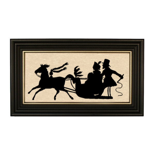 Christmas Christmas Dashing Through the Snow Framed Paper Cut Silhouette in Black Wood Frame with Gold Trim. A 5″ x 10″ framed to 7″ x 12″.