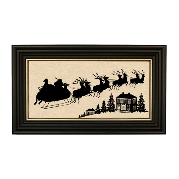 Christmas Christmas Santa Clause Is Coming Framed Paper Cut Silhouette in Black Wood Frame with Gold Trim. A 5″ x 10″ framed to 7″ x 12″.