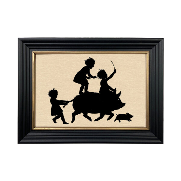 Farm/Pastoral Farm Children Riding Pig Framed Paper Cut Silhouette in Black Wood Frame with Gold Trim. An 6-3/4 x 10″ framed to 8-3/4 x 12″.