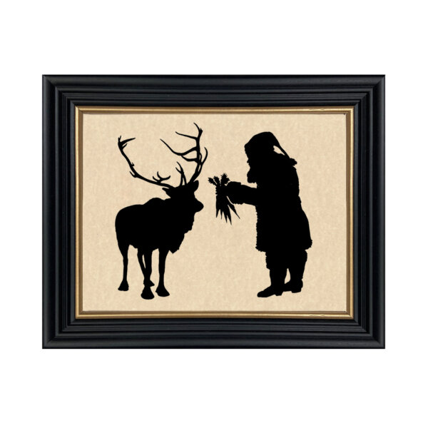 Christmas Christmas Santa Feeding Reindeer Framed Paper Cut Silhouette in Black Wood Frame with Gold Trim. An 8 x 10″ framed to 10 x 12″.
