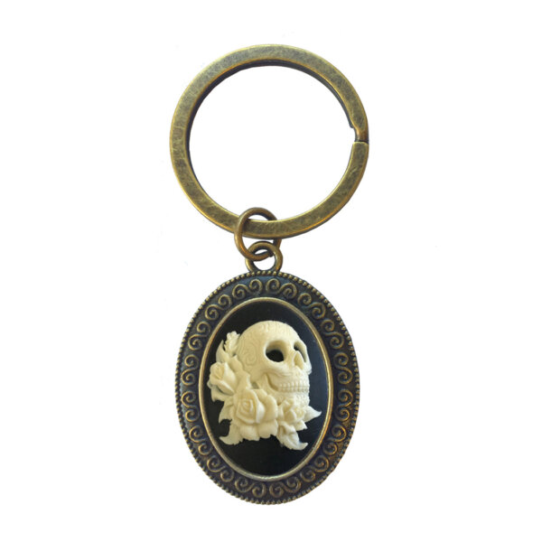 Jewelry Halloween 1″ black and cream cameo in a 1-3/8″ bronze color setting. Key ring diameter 1-1/8″.